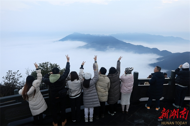 Tourists Enjoy Sunrise at Mountain Top
